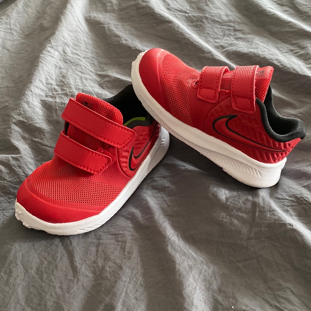 Red toddler Nike Velcro shoes